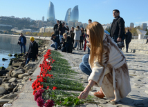 Baku residents bringing flowers to Seaside Boulevard to honor missing oil workers.  Azerbaijan, Dec.07, 2015